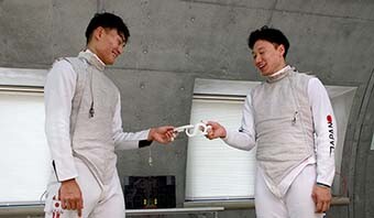 Image: Athletes enjoying Alphabet Fencing with beaming smiles